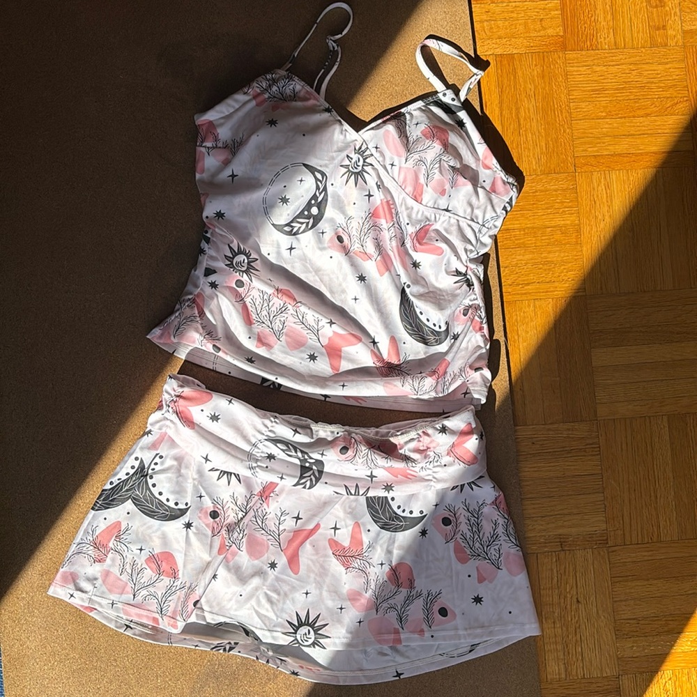 Two piece swim suit. NWOT never worn.